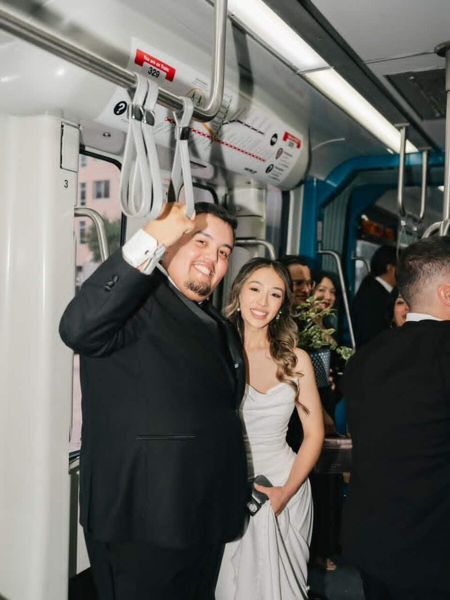 Aaron and Neidin on the METRORail on their wedding day